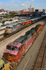 Westbound KCS Empty Grain Train Meeting an Eastbound BNSF Intermodal Train